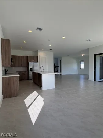 a view of kitchen with furniture and window