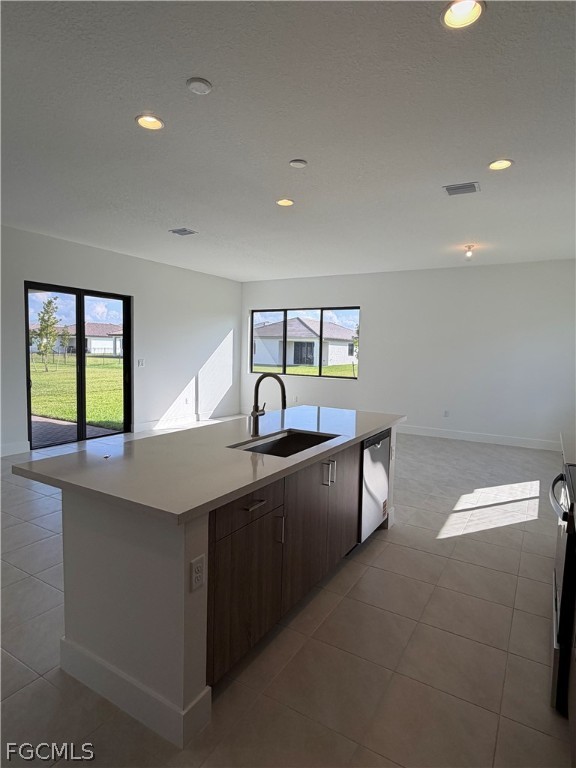 5166 Julienne Road Immokalee, FL 34142 - Photo 10 of 29 a kitchen with kitchen island a sink dishwasher a stove and a refrigerator with wooden floor
