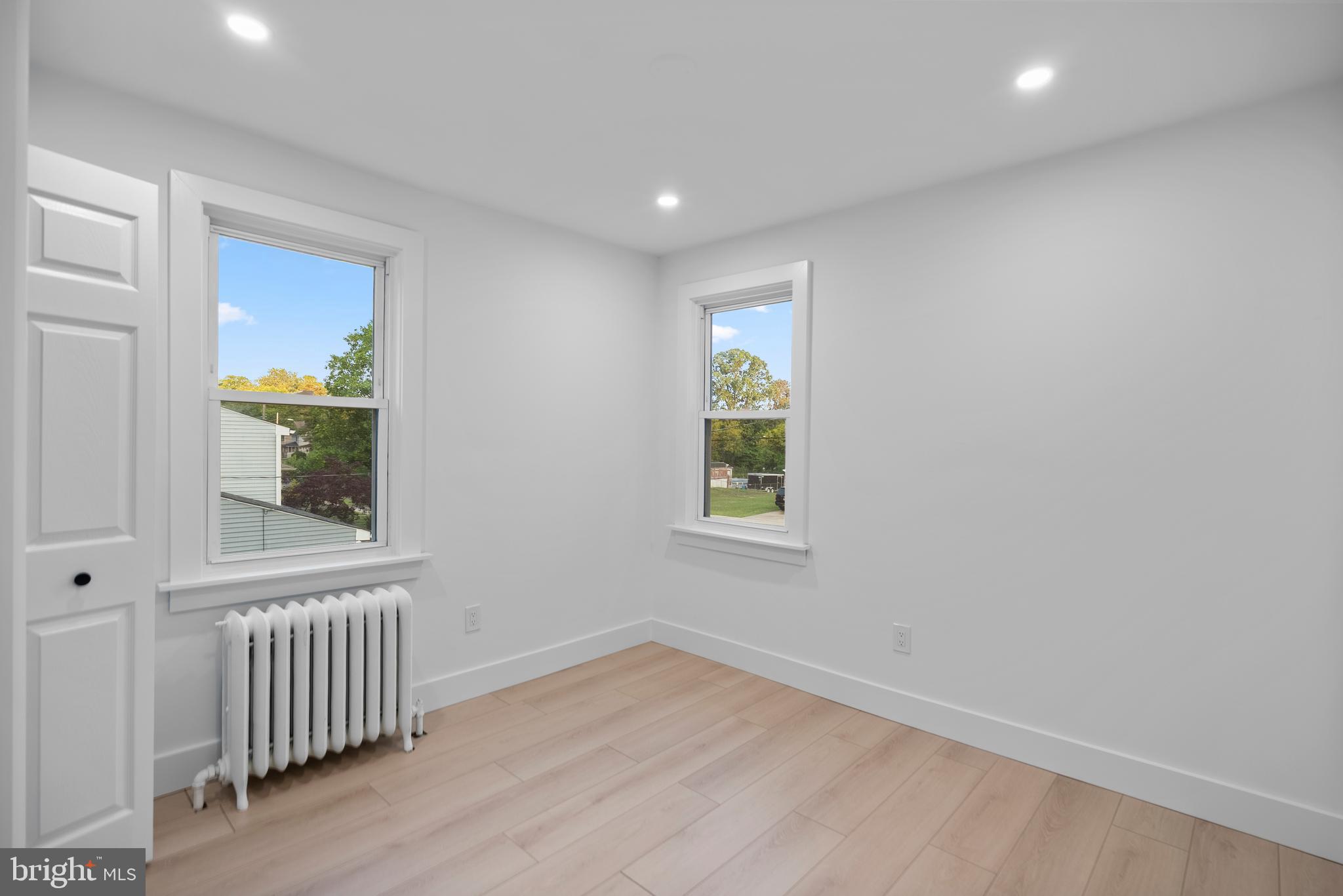 99 Chews Landing Road Clementon, NJ 08021 - Photo 17 of 37 an empty room with a window and wooden floor