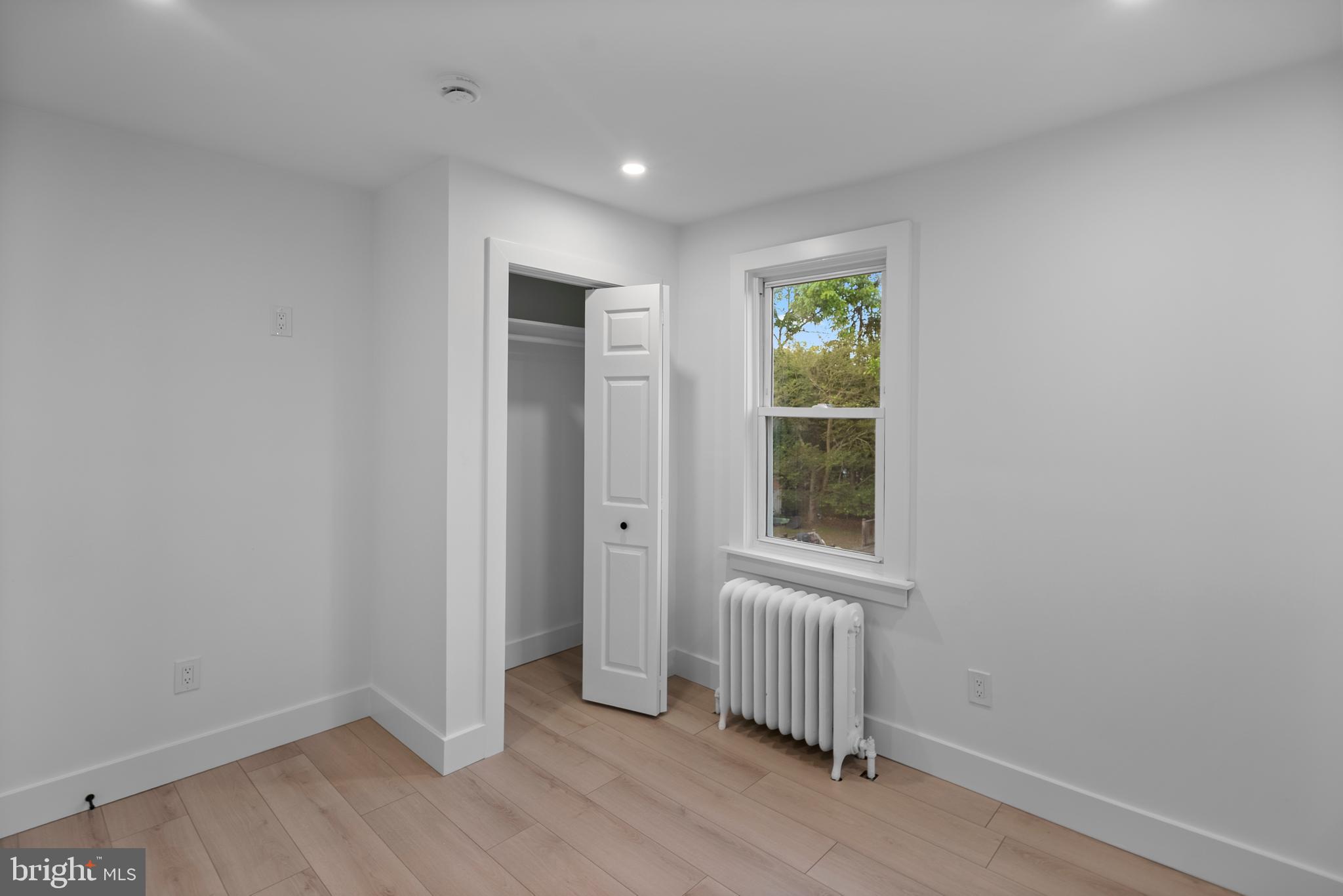 99 Chews Landing Road Clementon, NJ 08021 - Photo 18 of 37 an empty room with wooden floor and windows