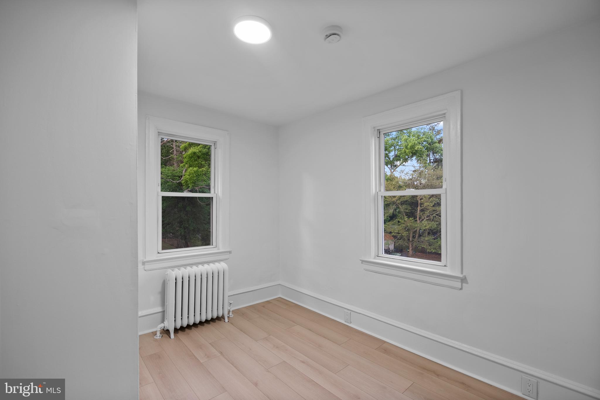 99 Chews Landing Road Clementon, NJ 08021 - Photo 19 of 37 an empty room with wooden floor and windows