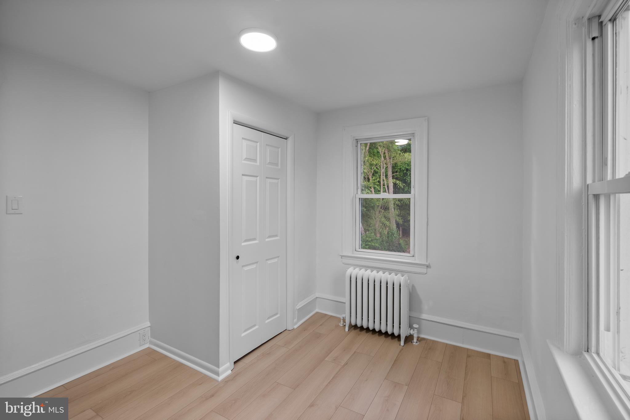 99 Chews Landing Road Clementon, NJ 08021 - Photo 20 of 37 an empty room with wooden floor and windows