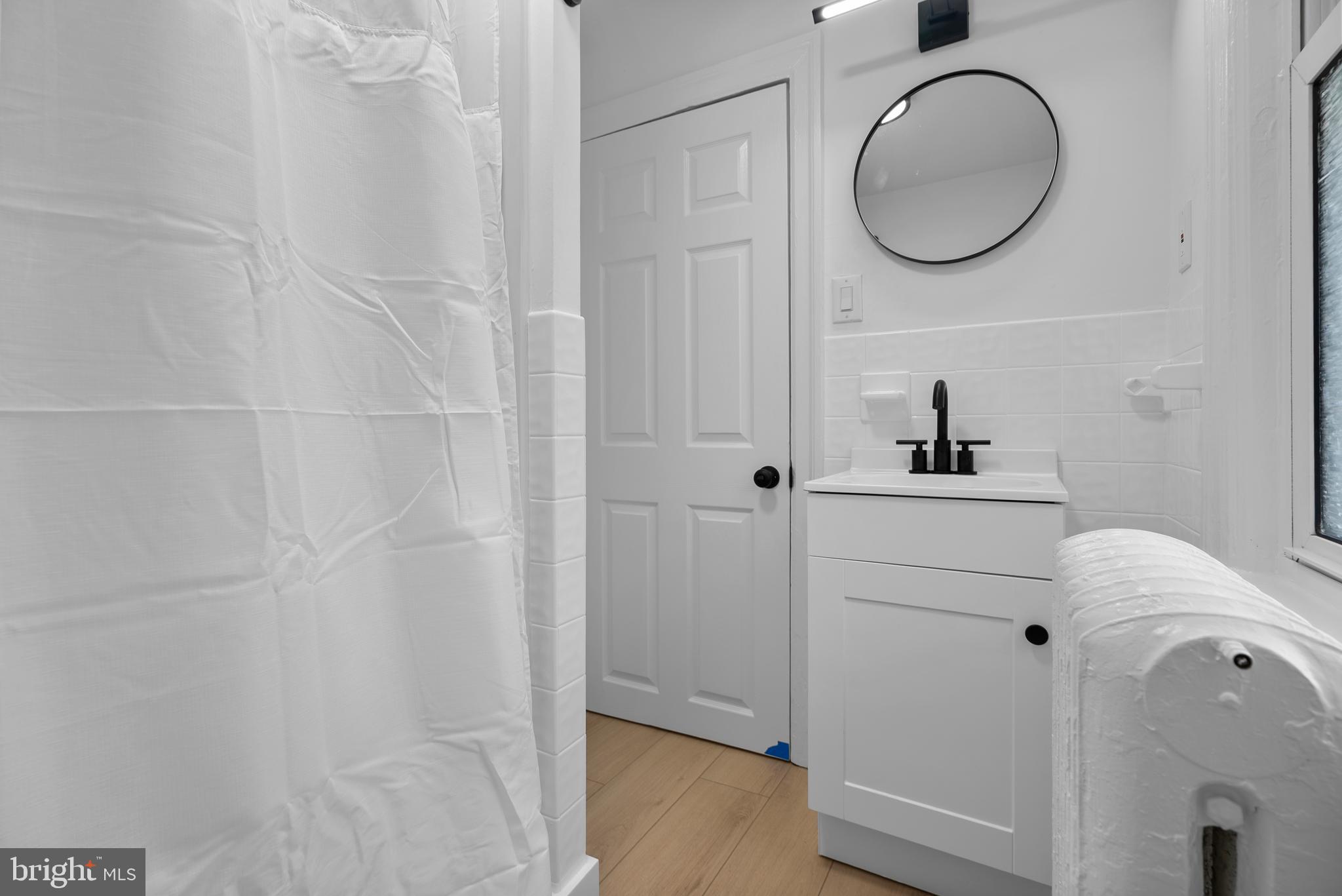 99 Chews Landing Road Clementon, NJ 08021 - Photo 22 of 37 a bathroom with a sink and a mirror