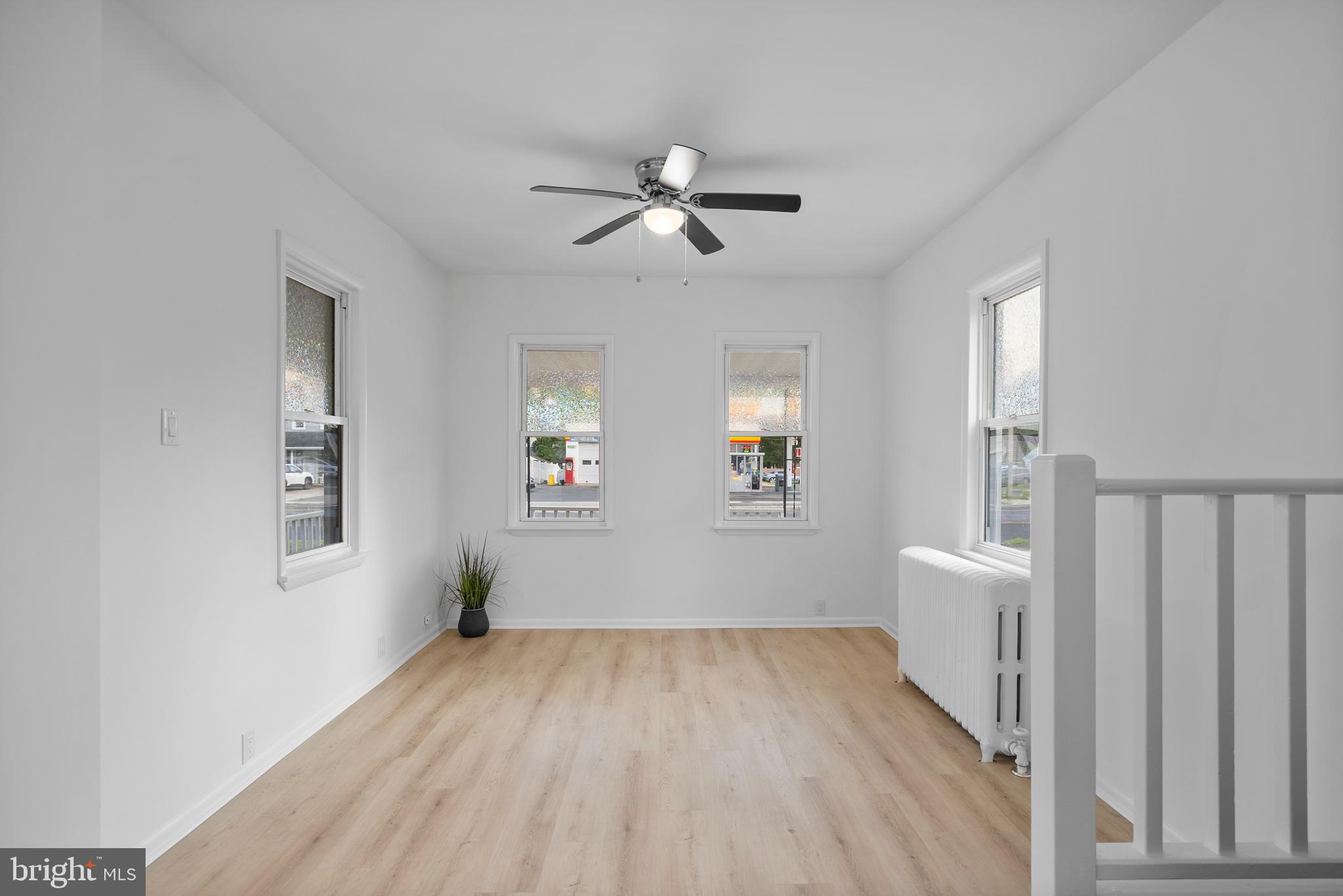 99 Chews Landing Road Clementon, NJ 08021 - Photo 8 of 37 wooden floor in an empty room with a window