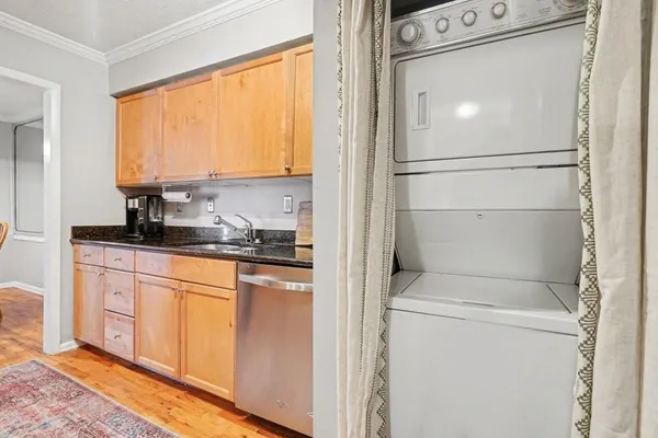 a kitchen with a refrigerator and a sink