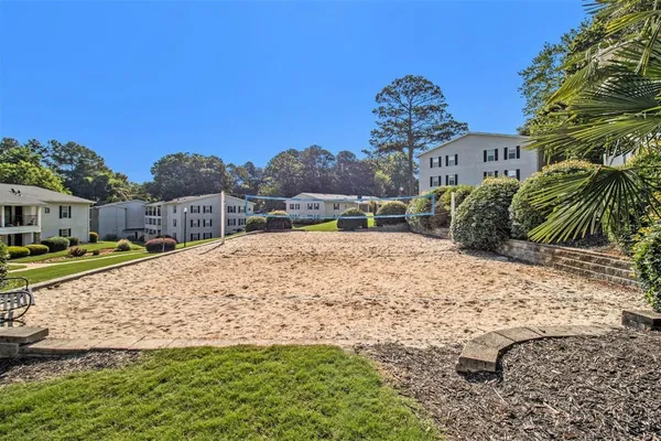 a view of a backyard with swimming pool
