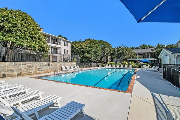 a view of a swimming pool with a patio