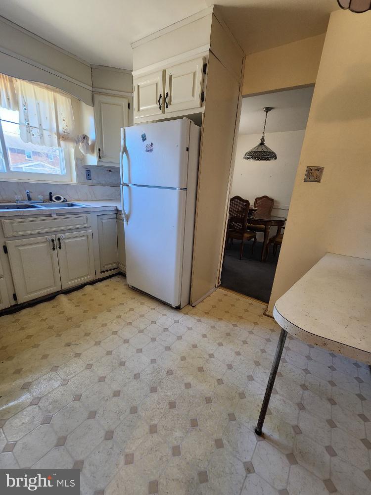 1108 Chaplin Street Southeast Washington, DC 20019 - Photo 16 of 35 a kitchen with a refrigerator and a sink