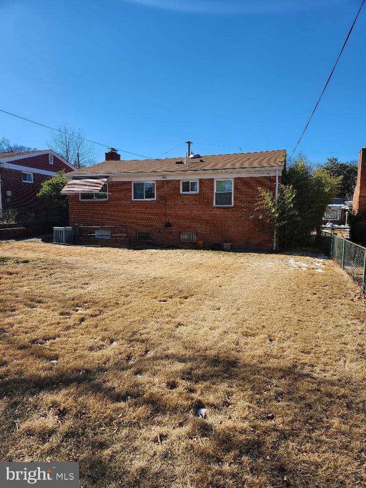 1108 Chaplin Street Southeast Washington, DC 20019 - Photo 34 of 35 a front view of a house with a yard