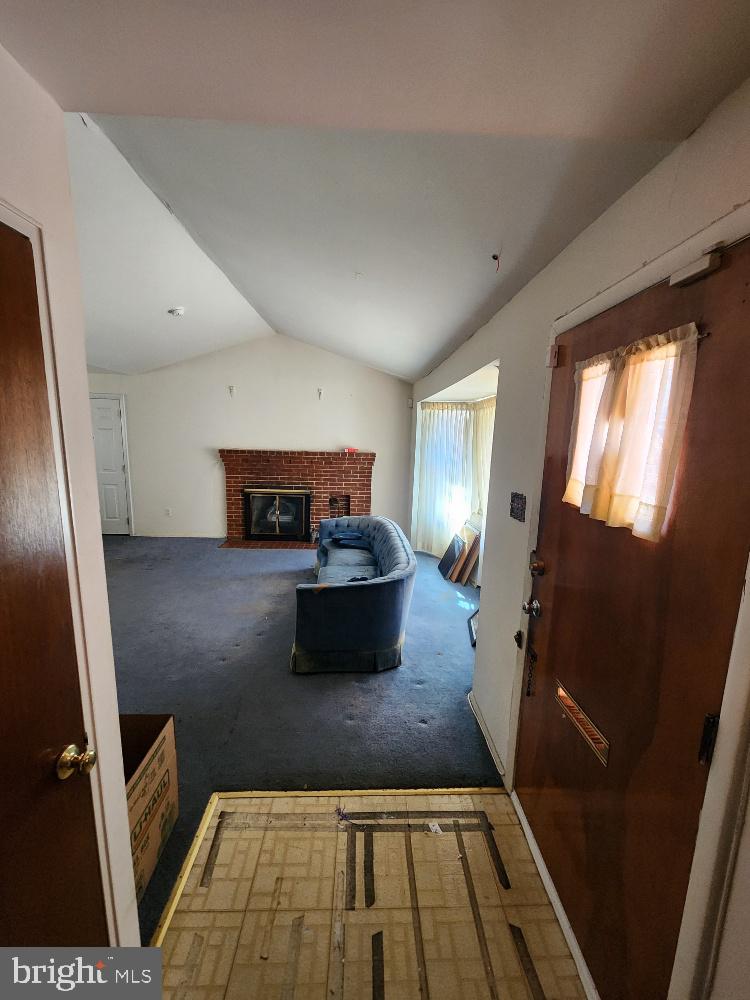 1108 Chaplin Street Southeast Washington, DC 20019 - Photo 5 of 35 a living room with furniture and a rug