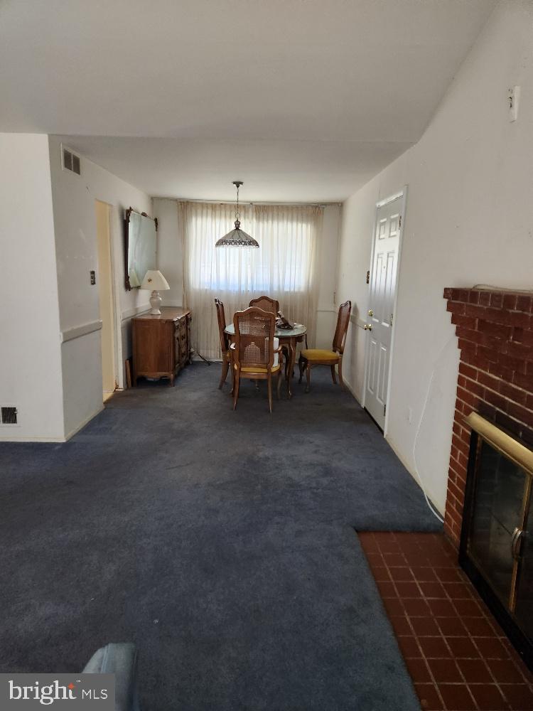 1108 Chaplin Street Southeast Washington, DC 20019 - Photo 7 of 35 a living room with furniture and a fireplace