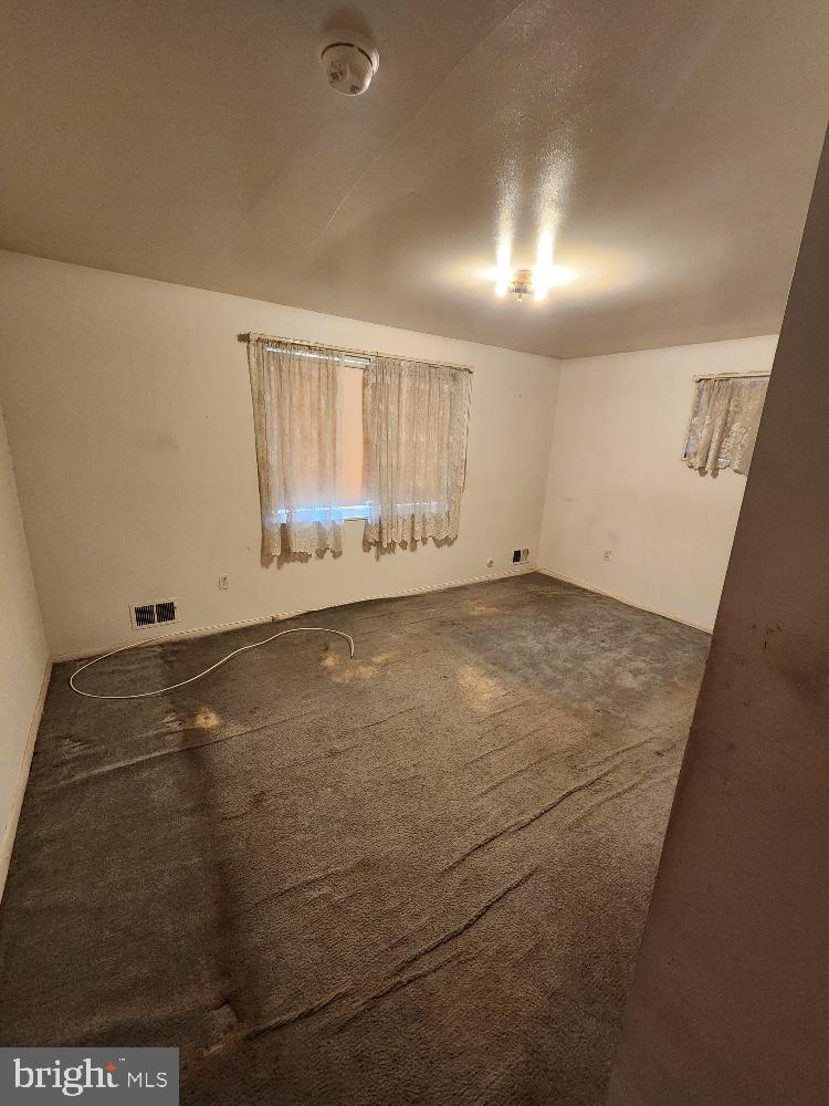 1108 Chaplin Street Southeast Washington, DC 20019 - Photo 10 of 35 an empty room with windows