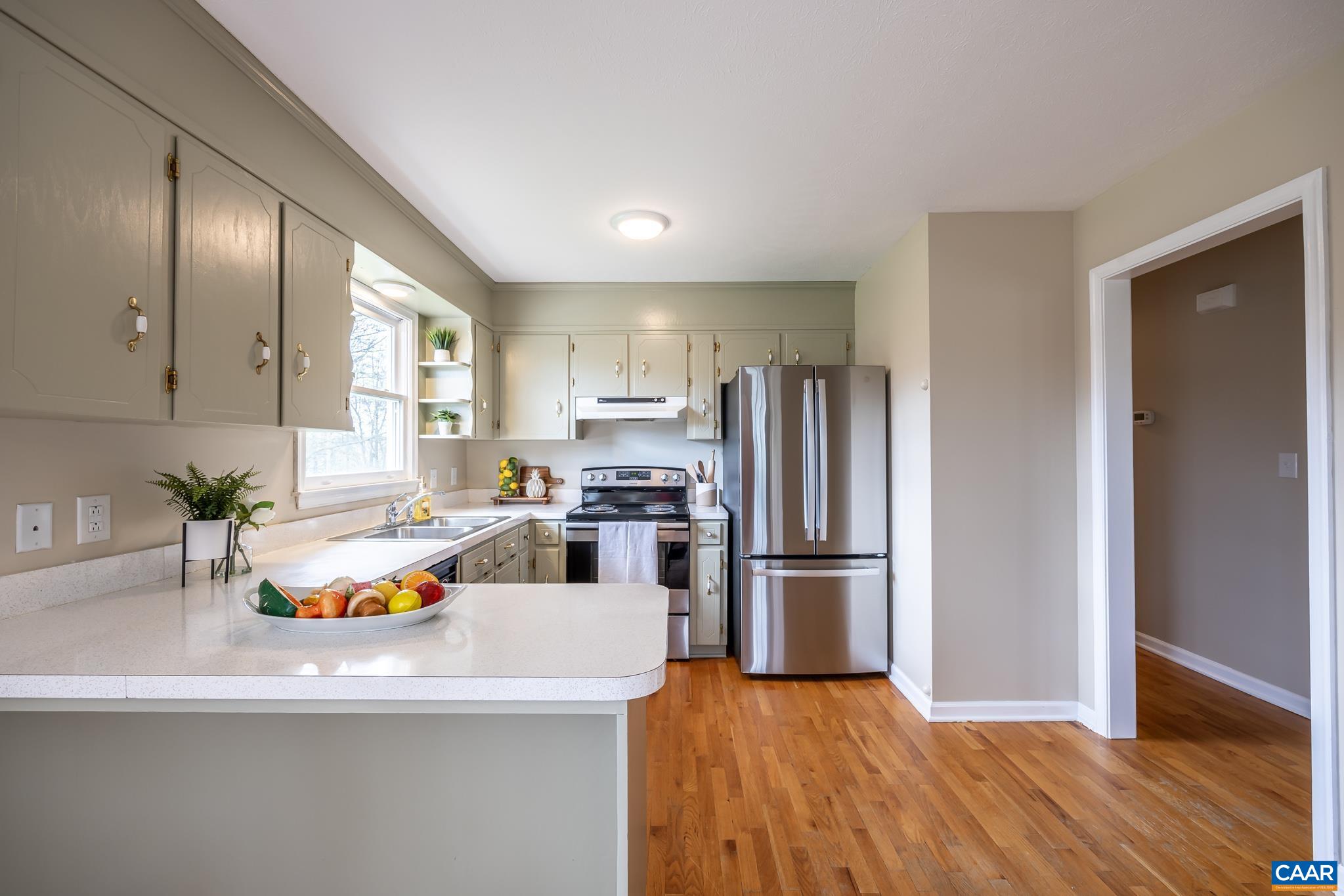 100 East Daffodil Road Ruckersville, VA 22968 - Photo 20 of 41 a kitchen with granite countertop stainless steel appliances a refrigerator and a counter space
