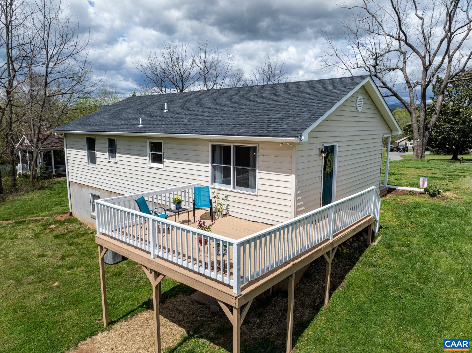 100 East Daffodil Road Ruckersville, VA 22968 - Photo 4 of 41 a view of a house with a yard and deck