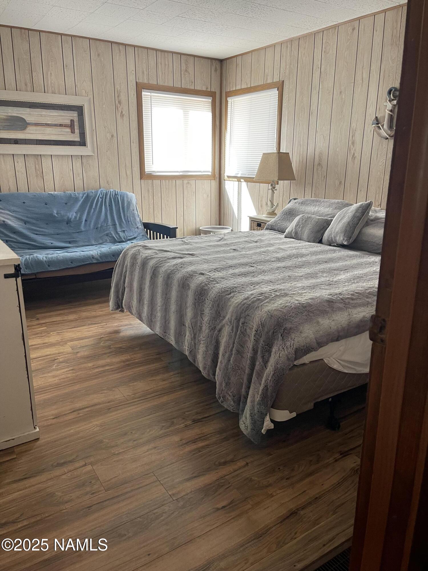 7681 East Robin Hood Road Williams, AZ 86046 - Photo 2 of 17 a bedroom with a bed and window