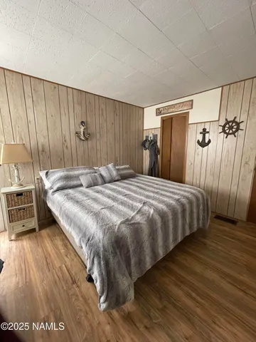 a bedroom with a bed and a table