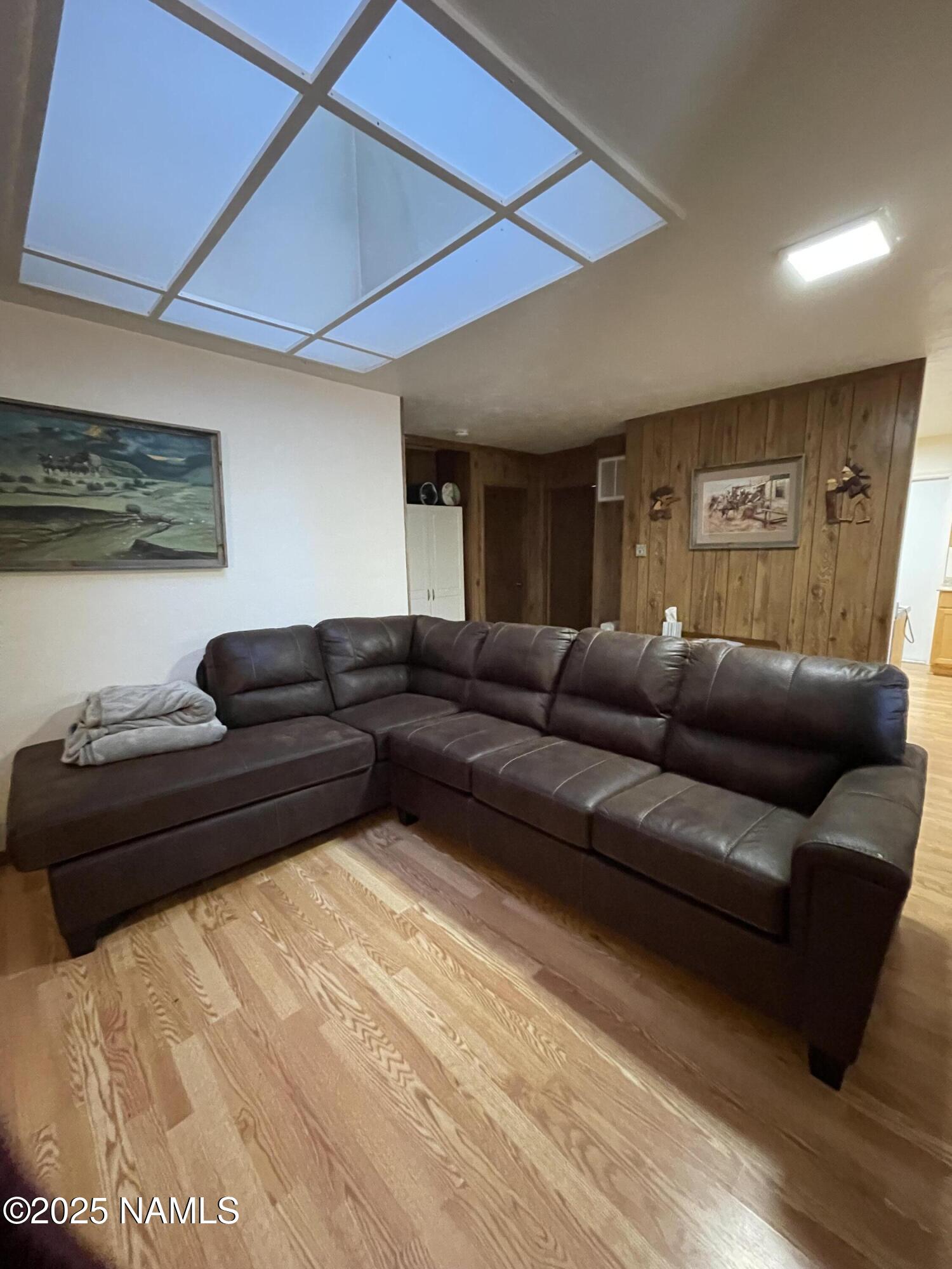 7681 East Robin Hood Road Williams, AZ 86046 - Photo 10 of 17 a living room with a couch and a coffee table