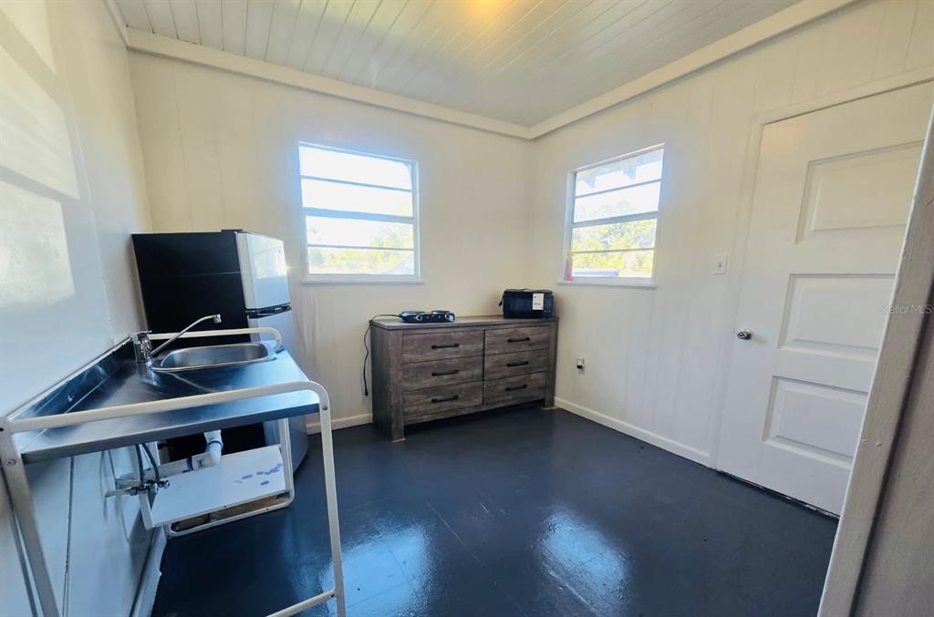 8010 Southeast Us Highway, Unit 5B Hawthorne, FL 32640 - Photo 2 of 7 a view of a workspace with furniture and a window