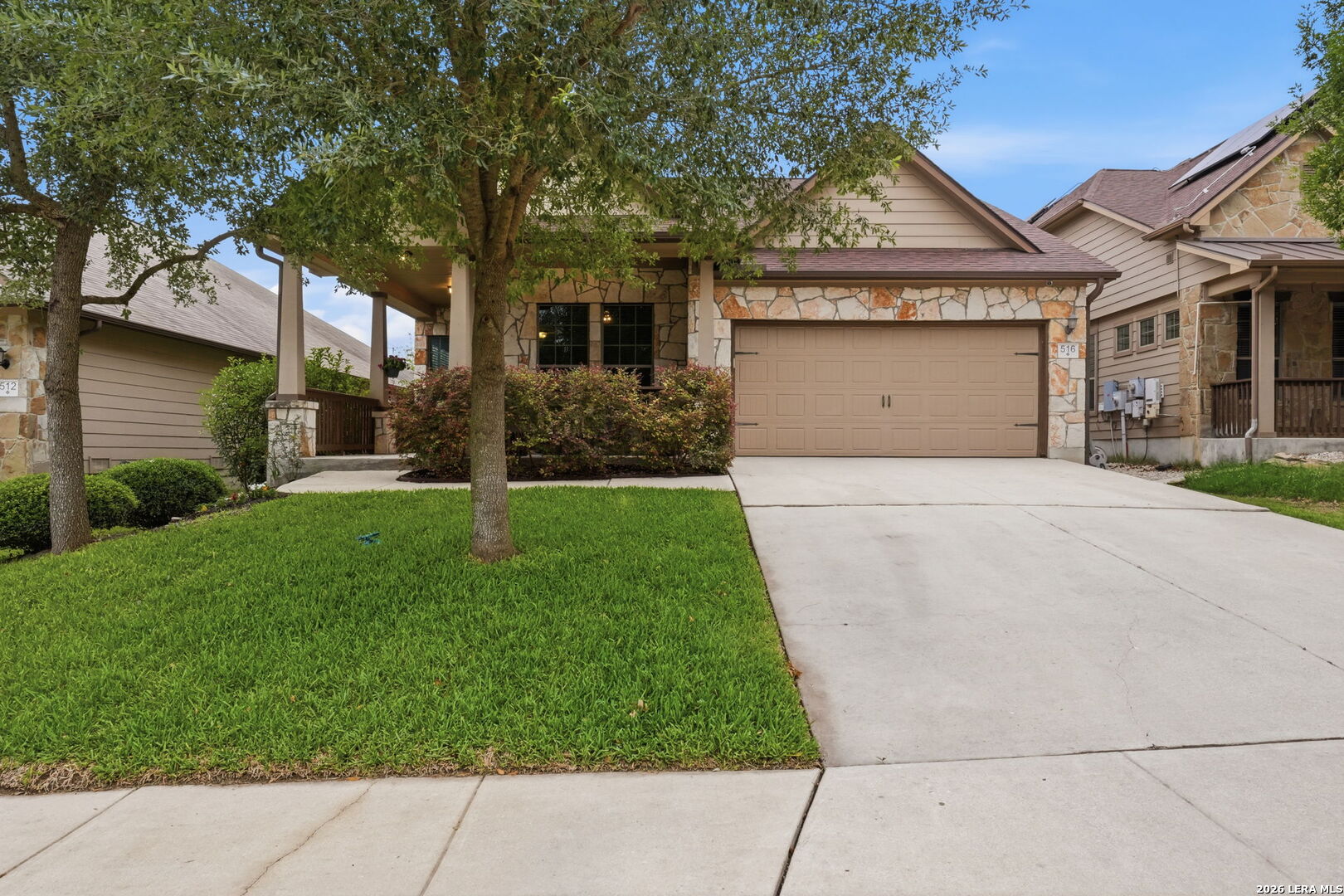 516 Brook Shadow Cibolo, TX 78108 - Photo 2 of 39 a front view of a house with a yard and garage