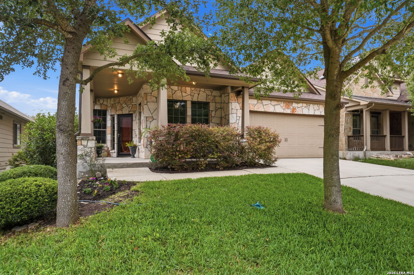 516 Brook Shadow Cibolo, TX 78108 - Photo 3 of 39 front view of a house with a yard and an trees