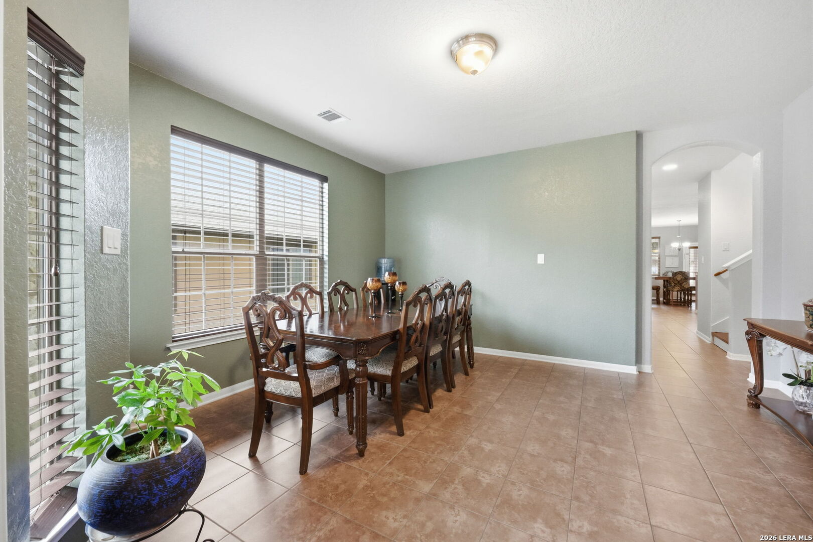 516 Brook Shadow Cibolo, TX 78108 - Photo 8 of 39 a view of a dining room with furniture and a potted plant