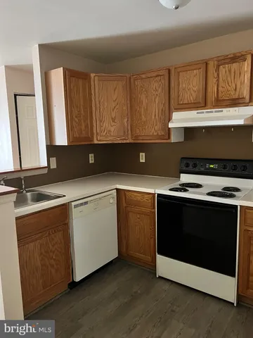 a kitchen with a stove and a sink