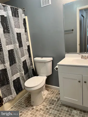a bathroom with a toilet and a sink