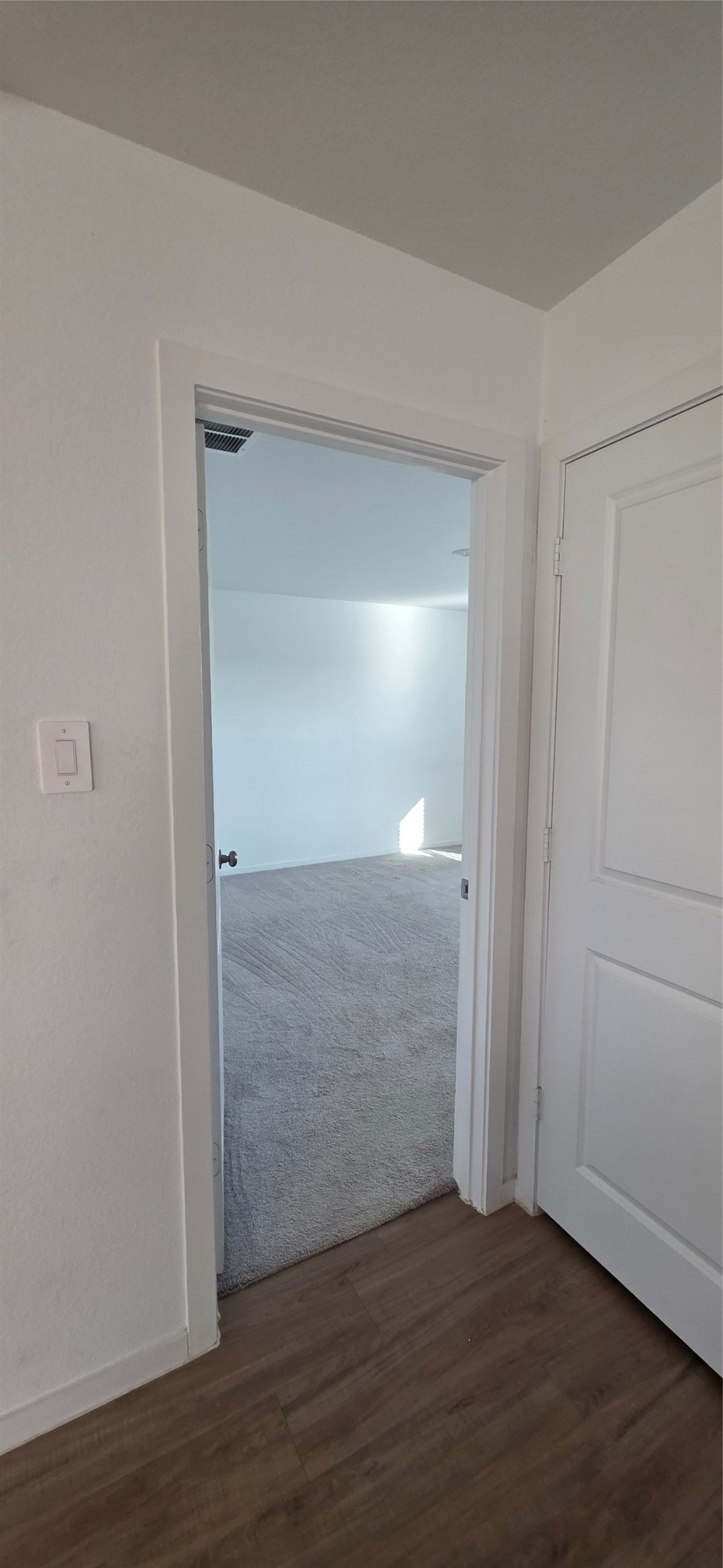 2410 Ridge Oak Drive Conroe, TX 77301 - Photo 20 of 31 an empty room with wooden floor & closet area