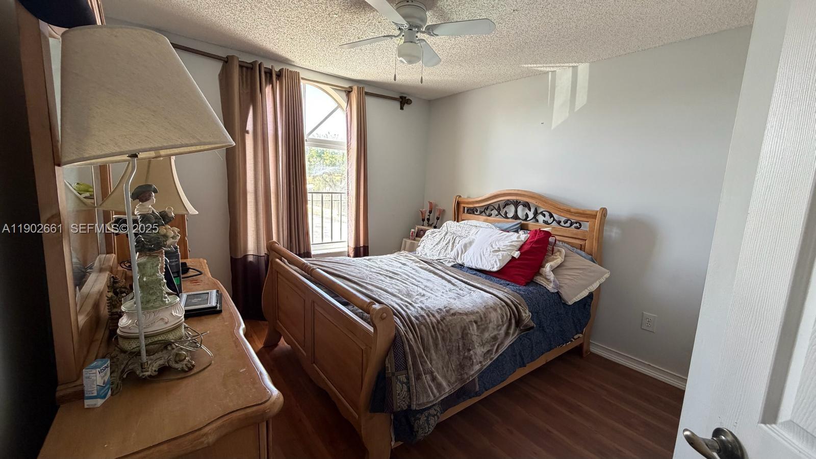 14713 Southwest 155th Place Miami, FL 33196 - Photo 14 of 23 a bedroom with a bed and a window