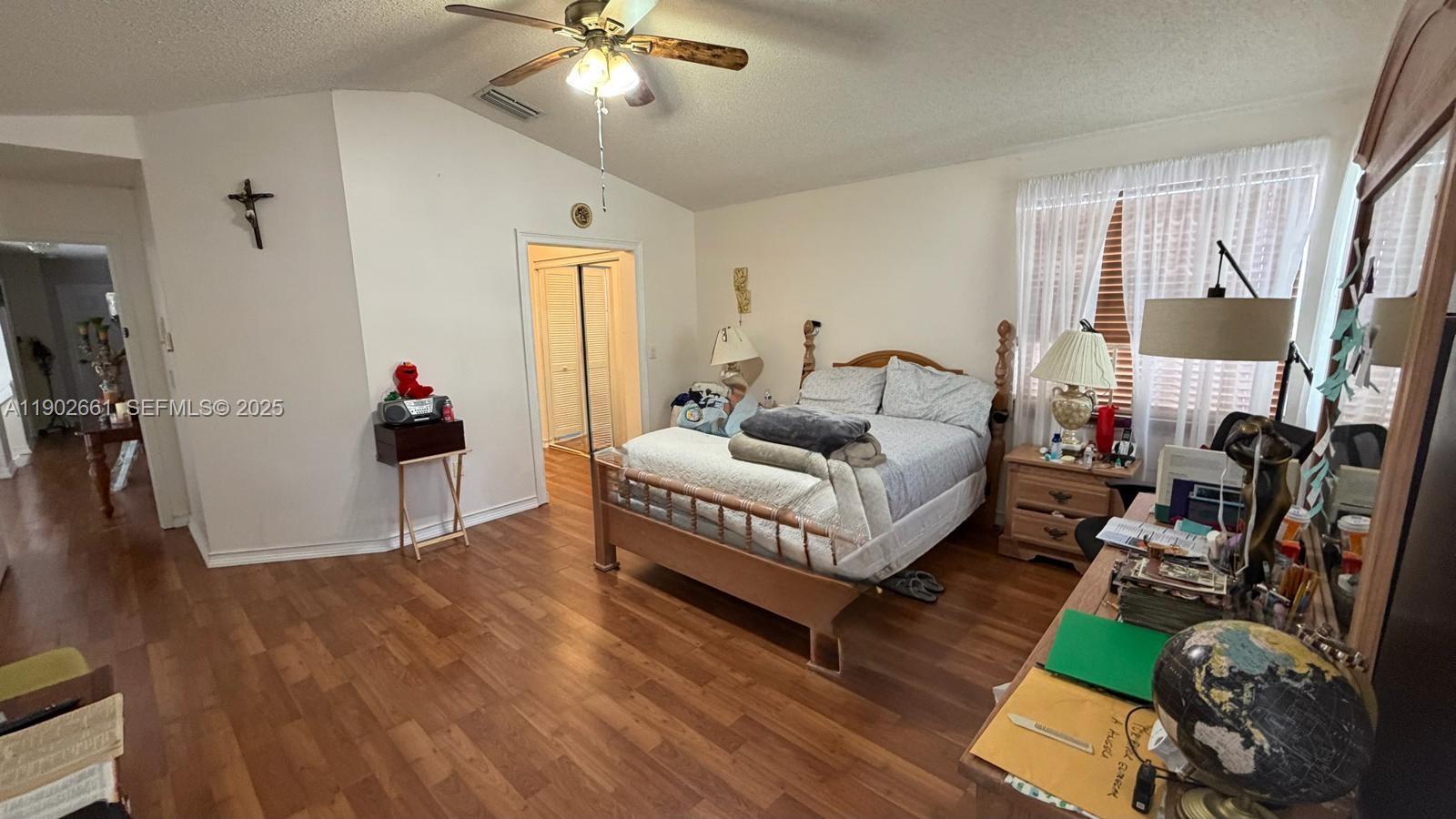 14713 Southwest 155th Place Miami, FL 33196 - Photo 16 of 23 a living room with furniture and a wooden floor