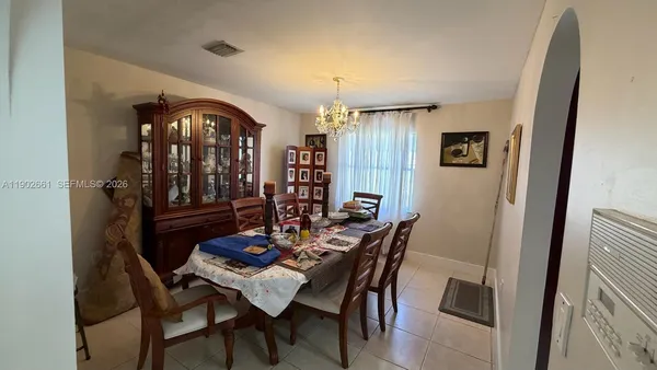 a view of a dining room with furniture and window