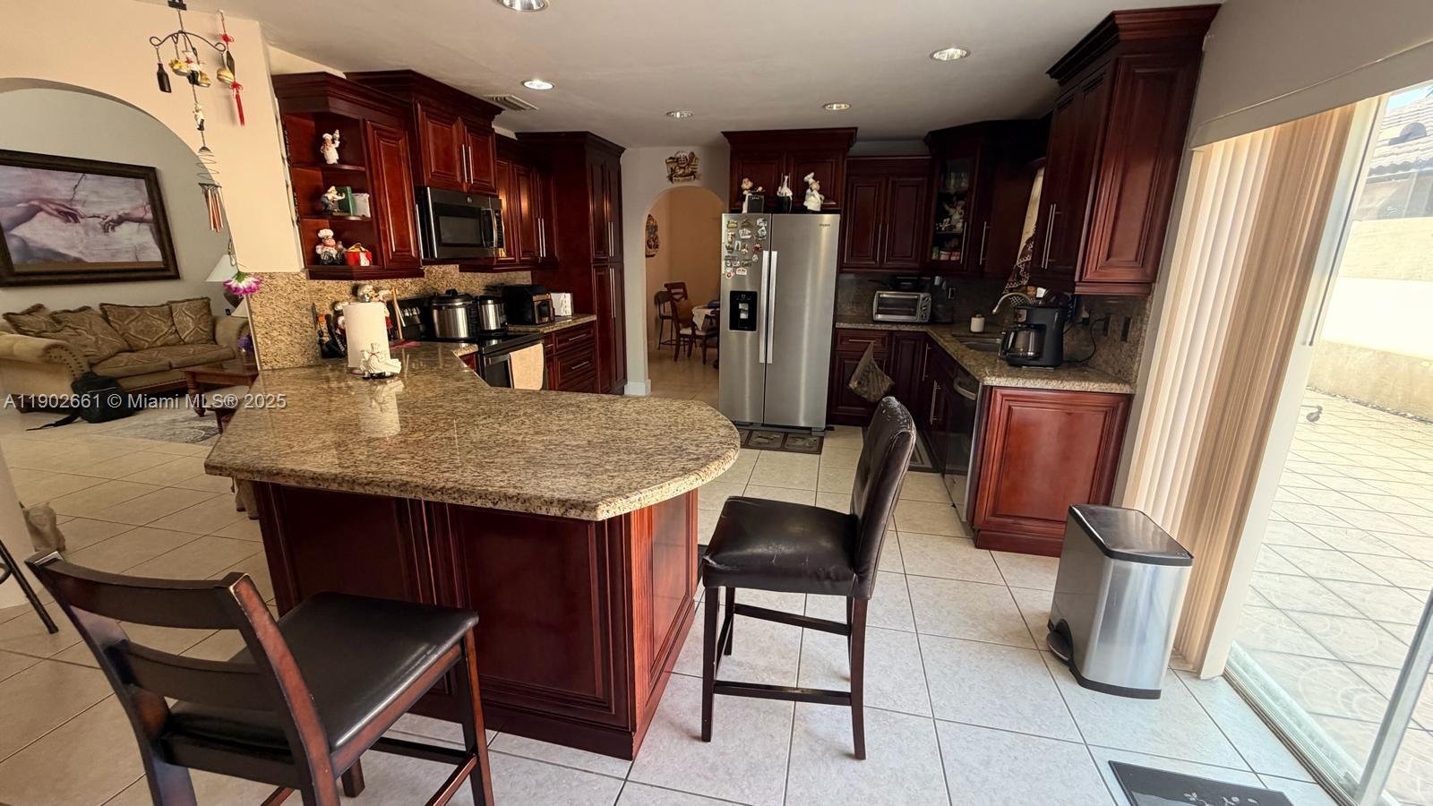 14713 Southwest 155th Place Miami, FL 33196 - Photo 7 of 23 a view of a dining room with furniture