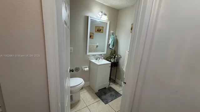 a bathroom with a toilet and a sink