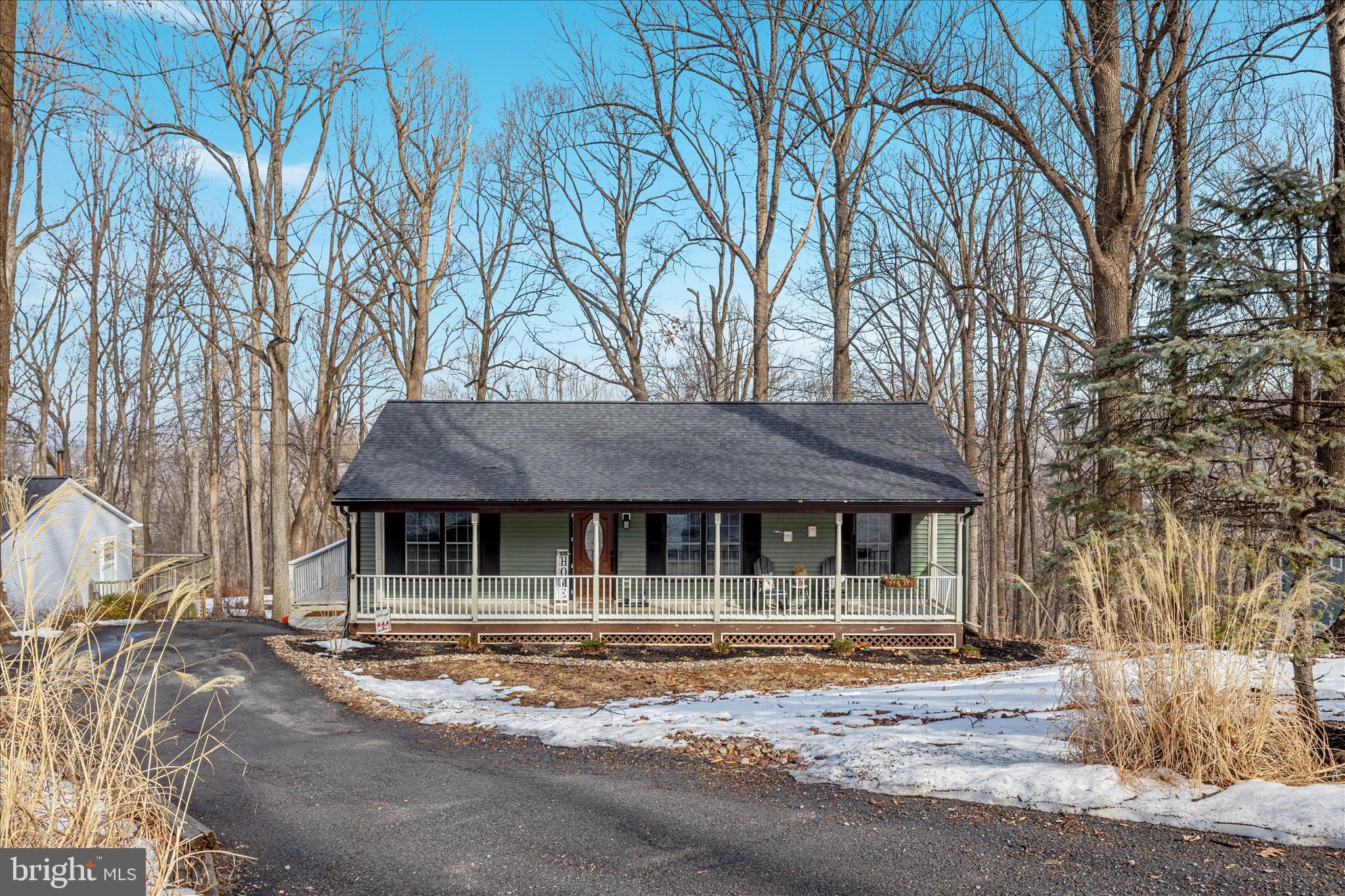 a house that has a tree in front of it