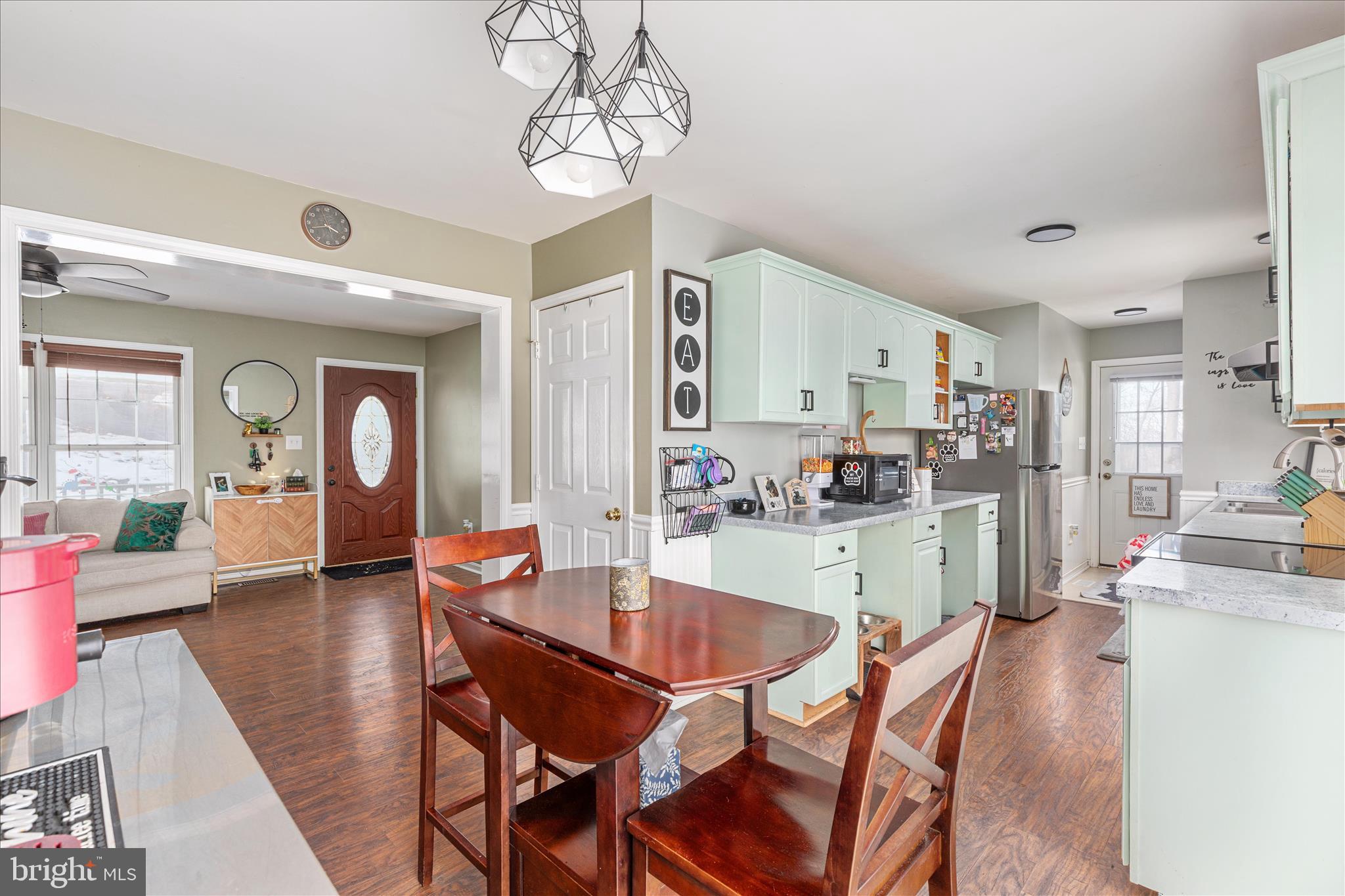 67 Pocahontas Road Front Royal, VA 22630 - Photo 11 of 49 a dining room with wooden floor and a chandelier