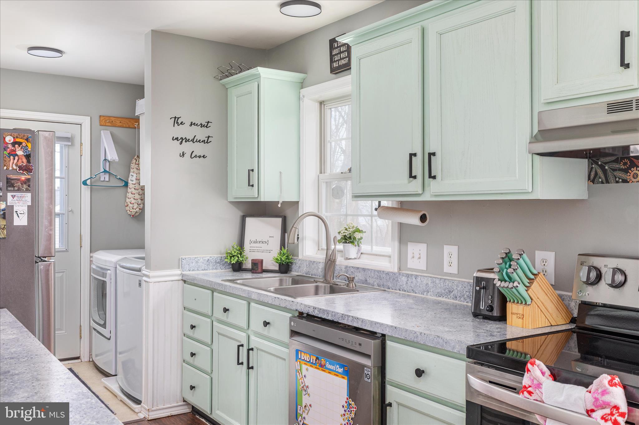 67 Pocahontas Road Front Royal, VA 22630 - Photo 14 of 49 a kitchen with stainless steel appliances granite countertop a sink stove and cabinets