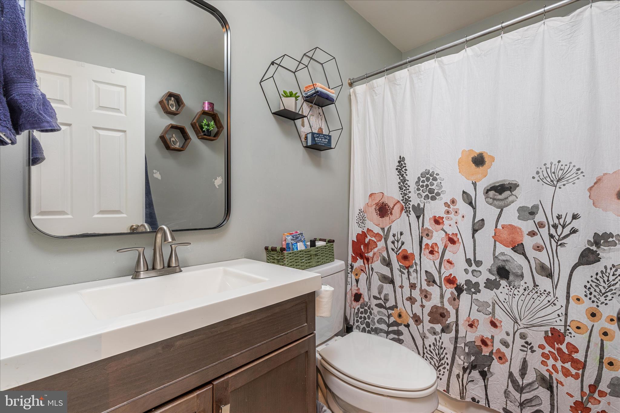 67 Pocahontas Road Front Royal, VA 22630 - Photo 20 of 49 a bathroom with a toilet sink and mirror