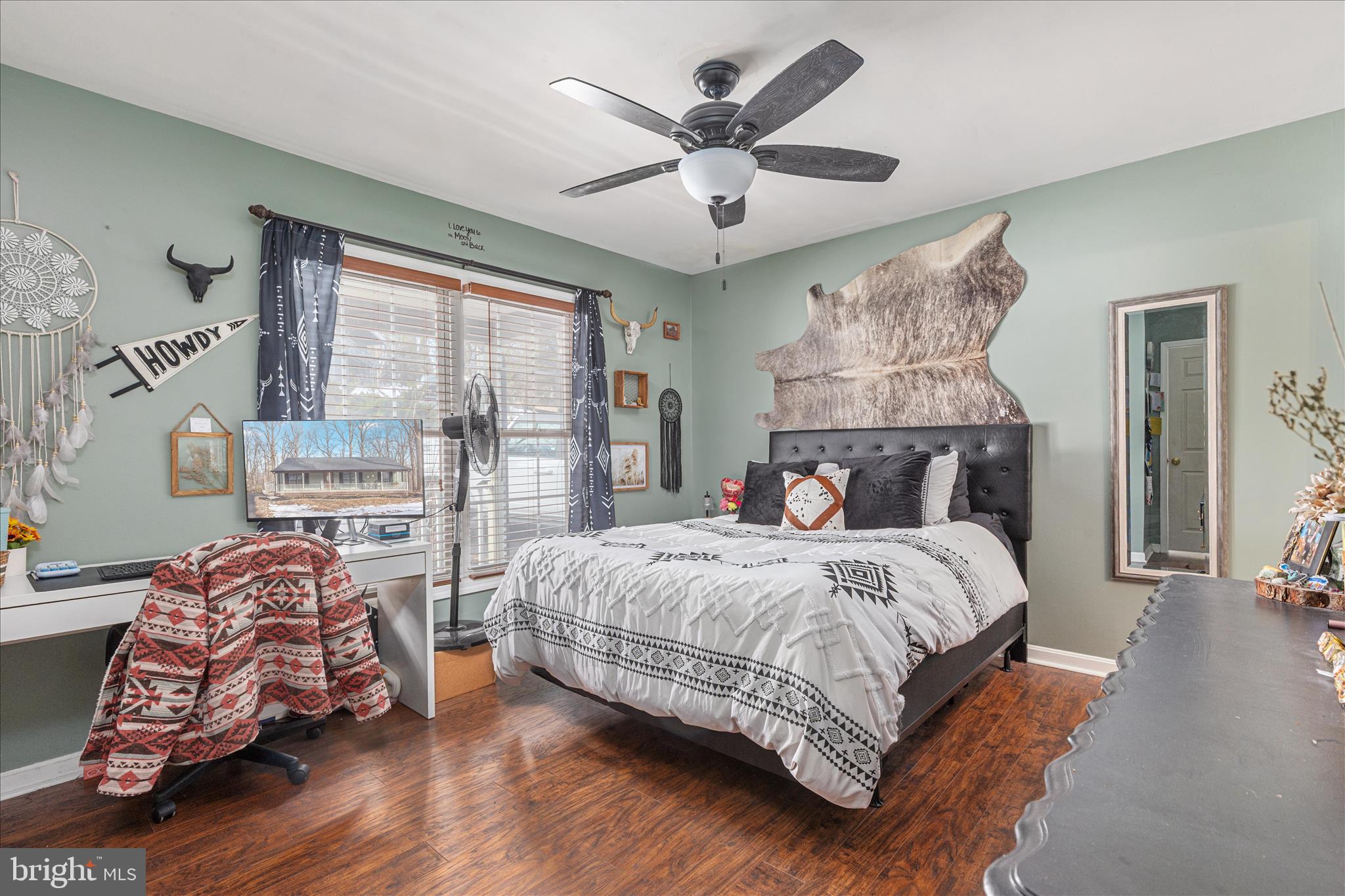 67 Pocahontas Road Front Royal, VA 22630 - Photo 21 of 49 a bedroom with a large bed and a chandelier