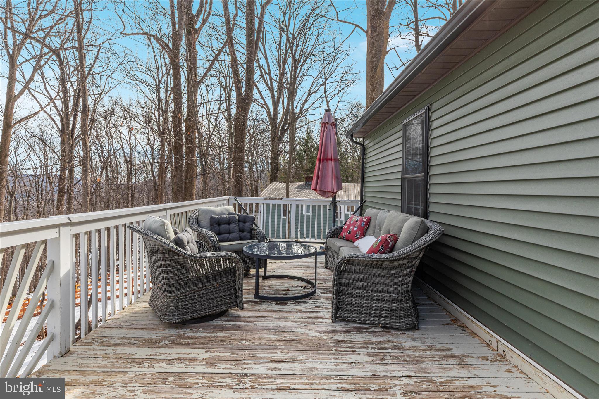 67 Pocahontas Road Front Royal, VA 22630 - Photo 33 of 49 a roof deck with table and chairs and wooden floor