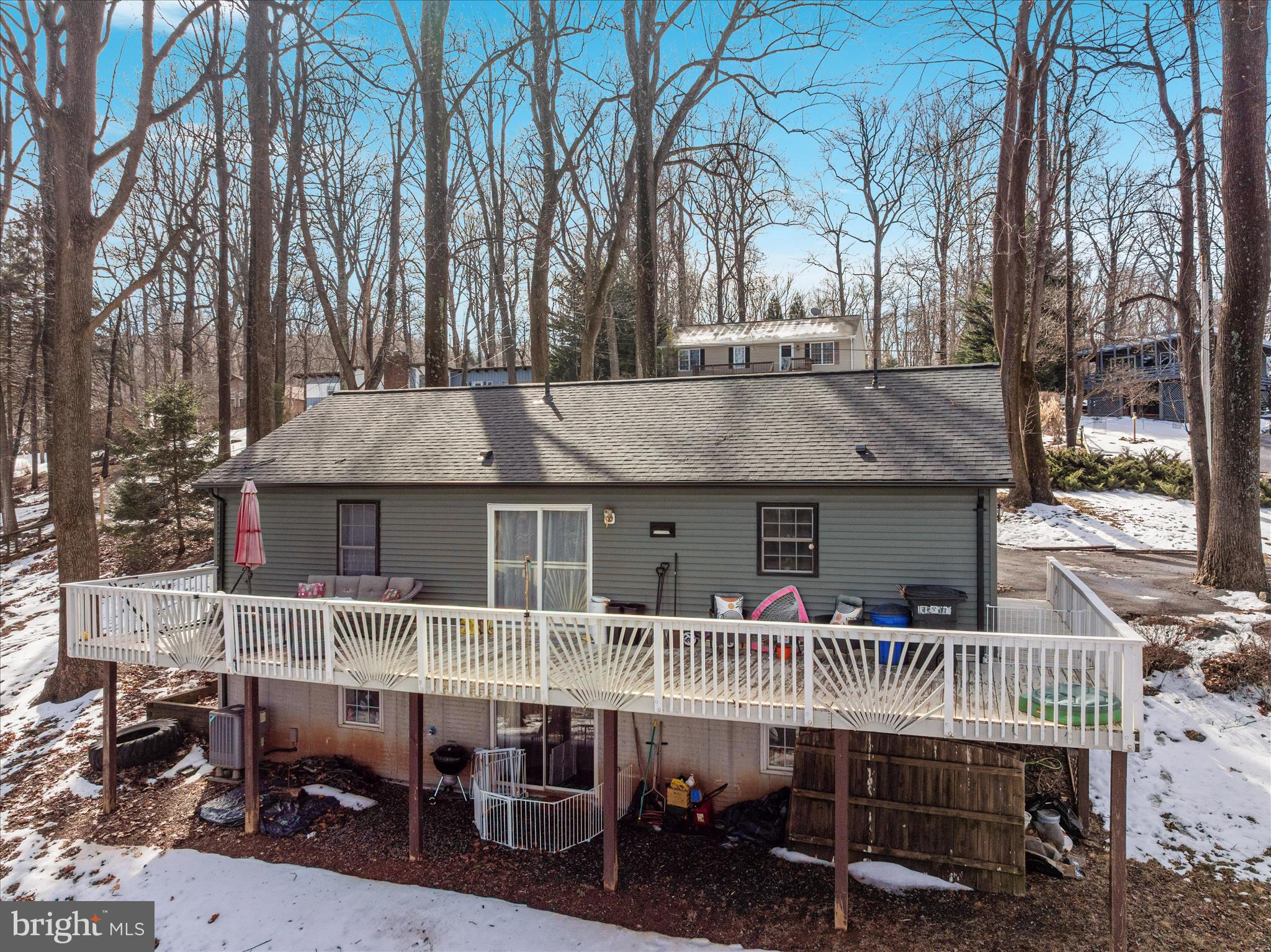 67 Pocahontas Road Front Royal, VA 22630 - Photo 45 of 49 a roof deck with table and chairs and potted plants