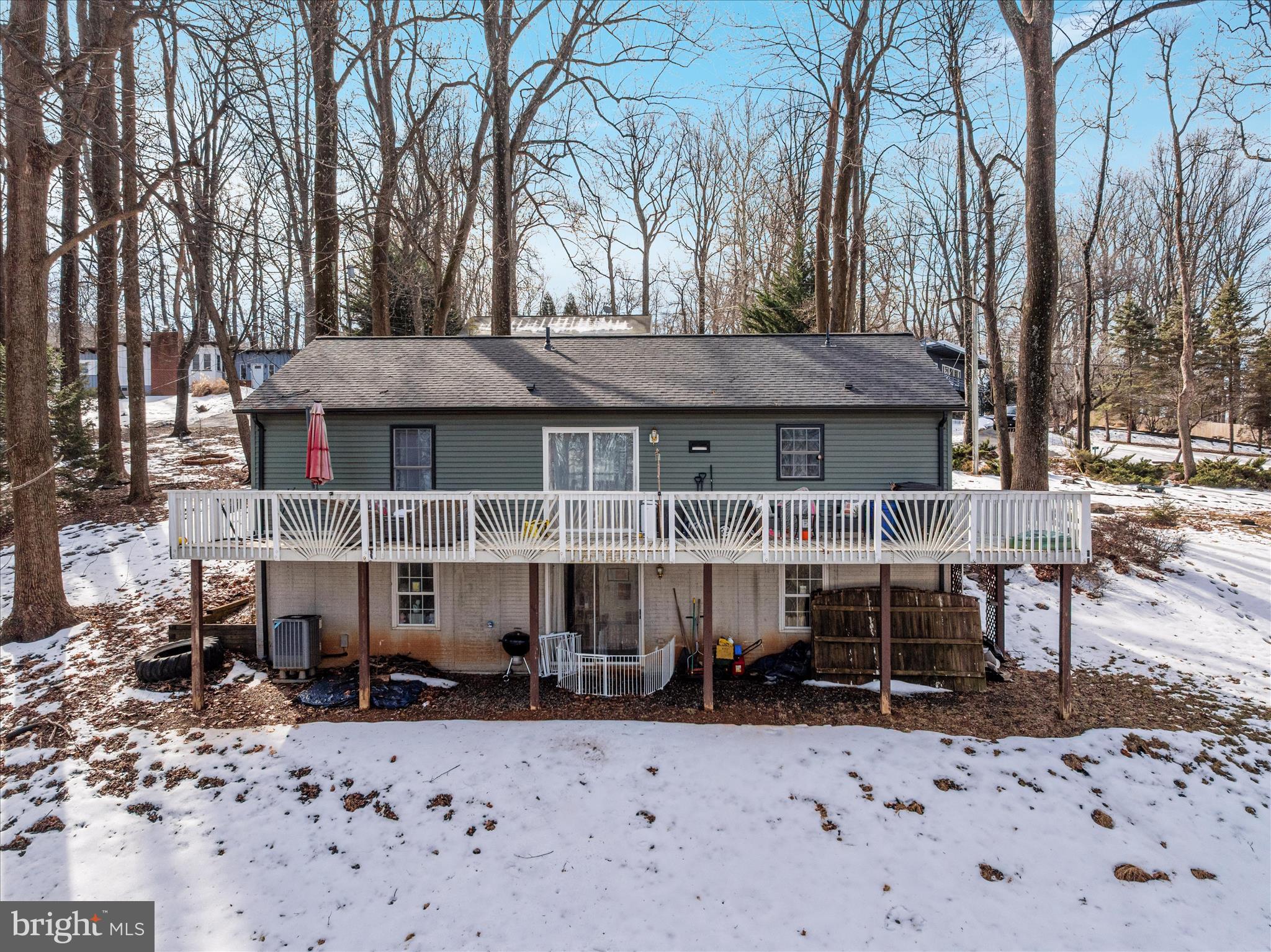 67 Pocahontas Road Front Royal, VA 22630 - Photo 46 of 49 a front view of a house with a yard covered with snow in front of house