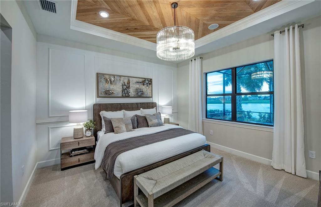 2126 Yellowfin Circle Naples, FL 34114 - Photo 16 of 29 a bedroom with bed and a window