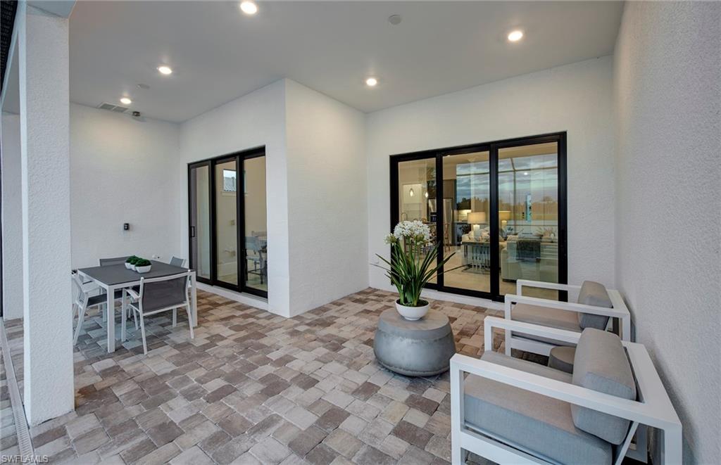 2126 Yellowfin Circle Naples, FL 34114 - Photo 23 of 29 a room with furniture and window