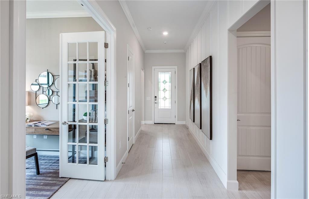 2126 Yellowfin Circle Naples, FL 34114 - Photo 6 of 29 wooden floor with a bathroom