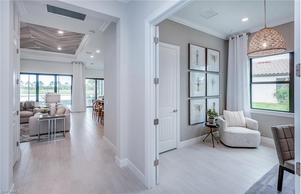2126 Yellowfin Circle Naples, FL 34114 - Photo 7 of 29 a living room with furniture and a large window