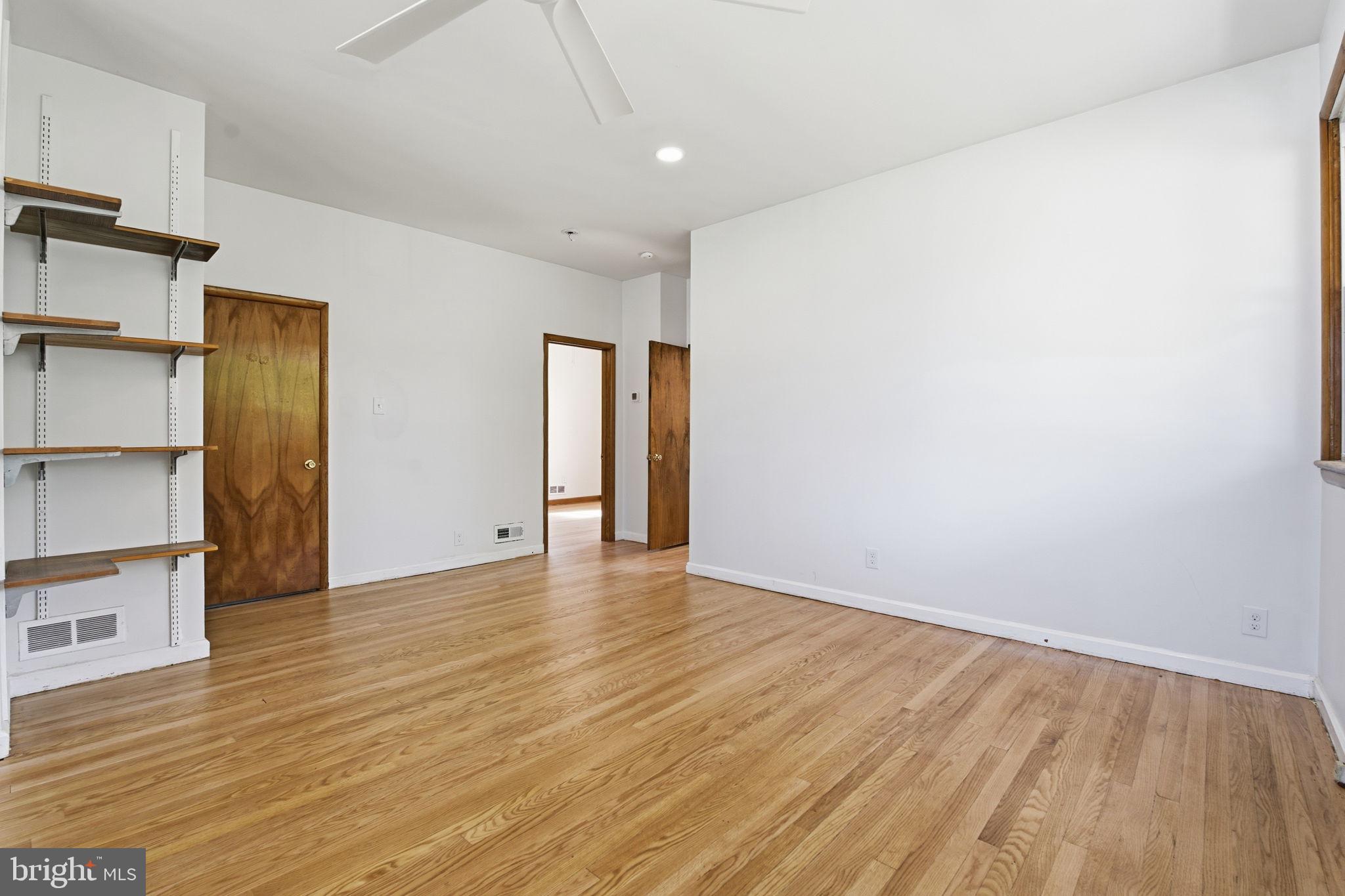2301 Bayside Drive Baltimore, MD 21221 - Photo 11 of 35 a view of empty room with wooden floor and fan