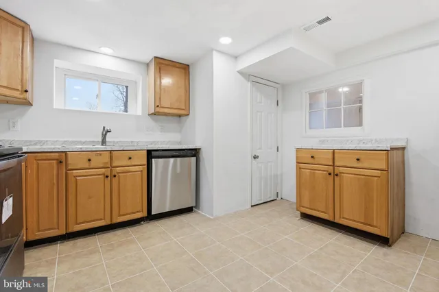a view of a kitchen with electric appliances