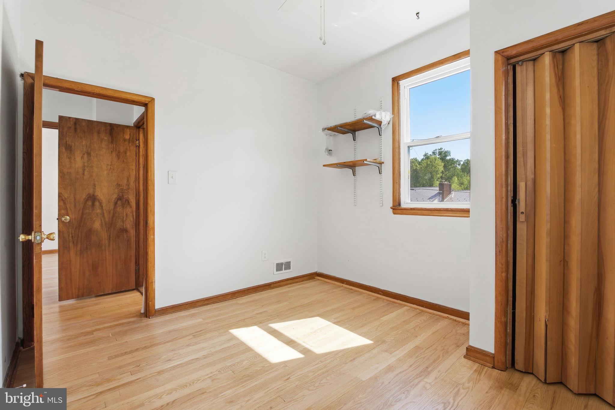 2301 Bayside Drive Baltimore, MD 21221 - Photo 20 of 35 a view of a room with wooden floor and a window