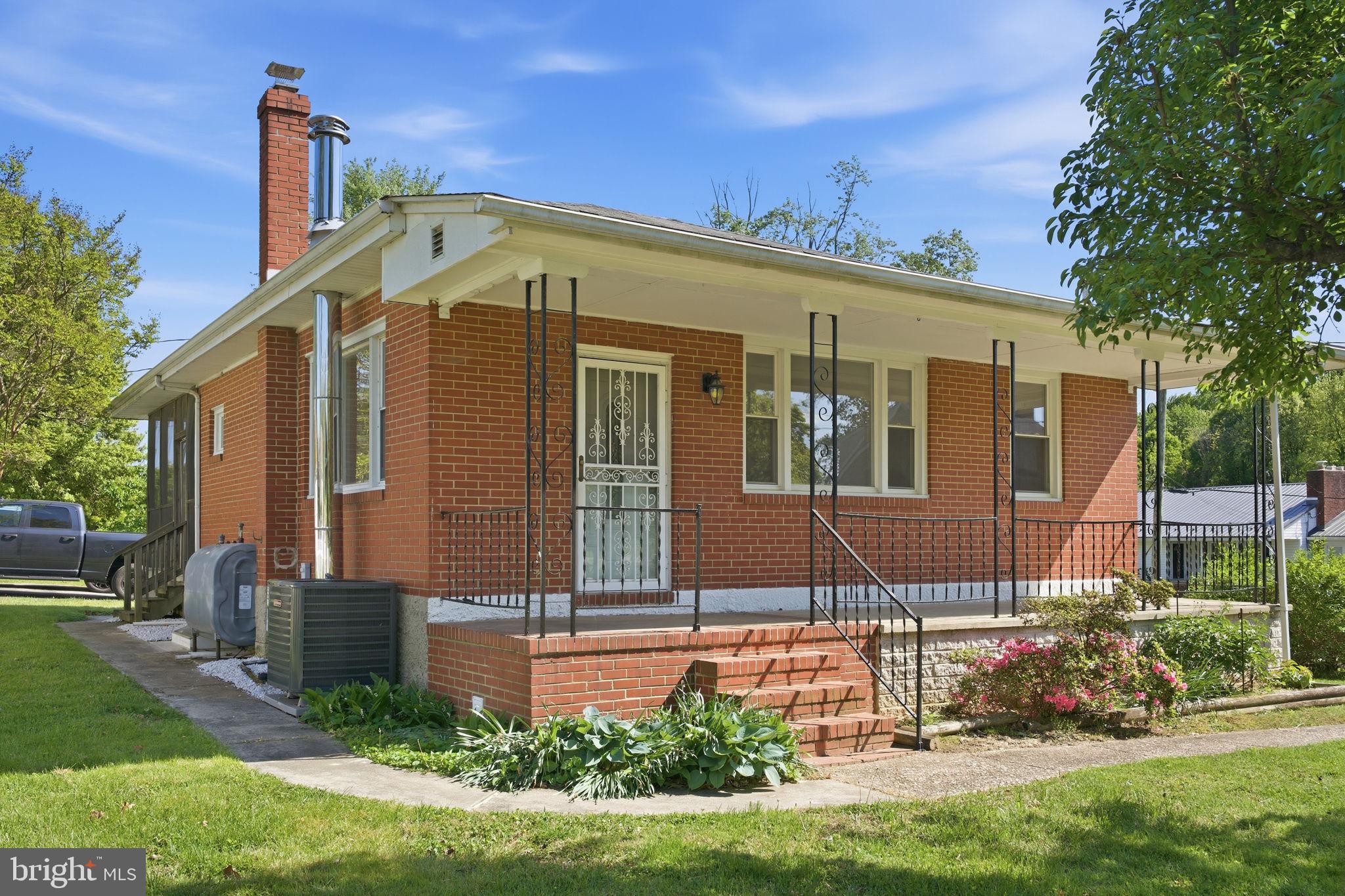 2301 Bayside Drive Baltimore, MD 21221 - Photo 2 of 35 a front view of a house with a yard