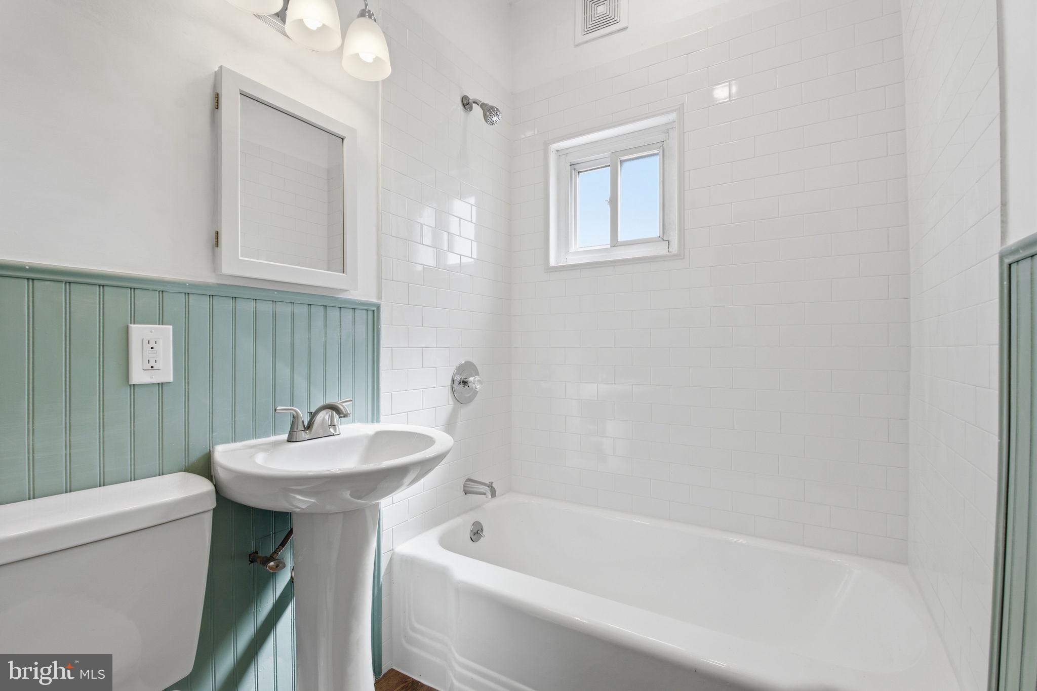 2301 Bayside Drive Baltimore, MD 21221 - Photo 24 of 35 a bathroom with a sink a toilet and shower